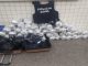 Dezenas de porções da mesma droga, balança, celulares e roupas camufladas também foram encontradas num imóvel utilizado para armazenar entorpecentes